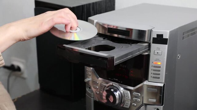 Knocks, rustling the CD tray of a music system when inserting a CD