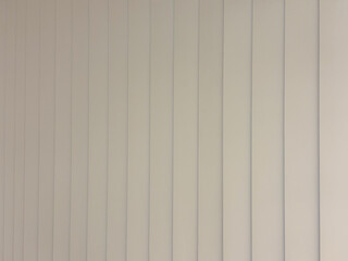Obraz premium Minimalist White Vertical Blinds Background with Soft Geometric Shadows