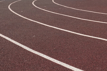 Fototapeta premium Sport floor. Interior of empty modern indoor sport court, coating Crumb rubber flooring, artificial. Sports surface with different marking lines. Recycled rubber Athletic field. Run track markup. 4K