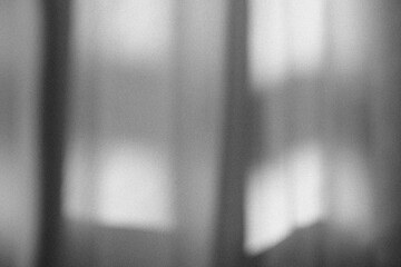 Monochrome abstract gradient texture with vintage film noise.