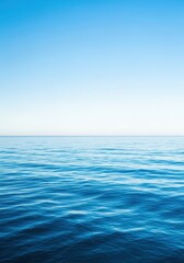 Obraz premium Expansive blue ocean meeting a soft, distant sky at the horizon line. A peaceful, tranquil view capturing the immense power of nature, sea, beach, wide