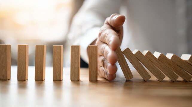 Stopping the Domino Effect: Hand Intervening to Prevent Wooden Blocks from Falling, Representing Risk Management