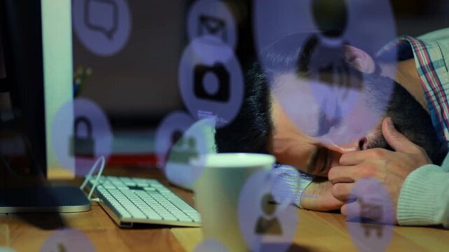 Animation of technology icons over caucasian man sleeping at desk with computer