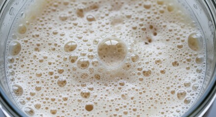 Close-Up View of Creamy Foam and Bubbles in a Freshly Prepared Beverage or Liquid