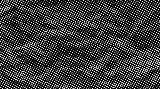 Halftone crumpled paper texture. Black and white dotted wrinkled surface. Creased sheet background in comic pop art style. Grainy folds and gritty distressed details for retro vector design.