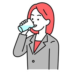 コップで水を飲むスーツの女性