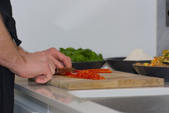 Finely Diced Red Chili Pepper on Wood Board
