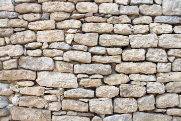 Obraz premium Mur en pierre apparente à jointoyer, piquage des joints