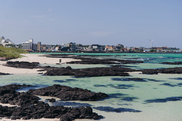Fototapeta premium Jeju Island, Hyeopjae Beach, Hallim, white sand beach and sea, Hallim-ro, Hallim-eup, Geumneung Beach, Jeju-do, South Korea, Jeju Province, landscape view in a sunny day, and Biyangdo island