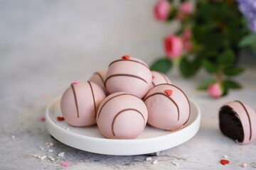 Chocolate Cake balls covered in pink icing | Valentines day sweets, selective focus