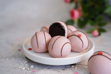 Chocolate Cake balls covered in pink icing | Valentines day sweets, selective focus