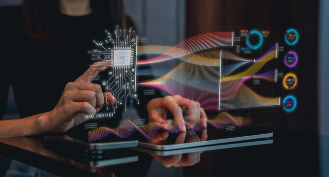 A person interacts with a futuristic touchscreen interface displaying colorful data visualizations and circuit patterns.