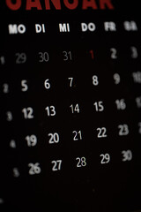 A black and red calendar with the number 28 on it
