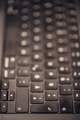 A close up of a keyboard with the keys in focus