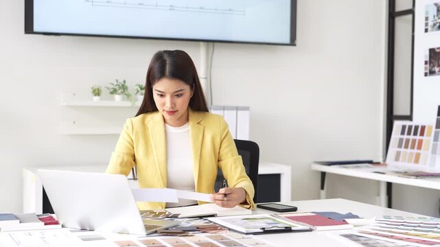 Architect or interior designers are finalizing the design of interiors by selecting materials and colors to design rooms to present to clients.