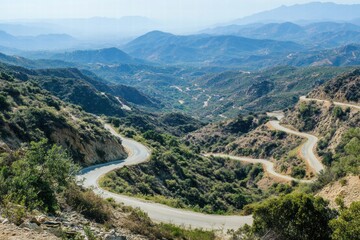Serpentine road through green hills