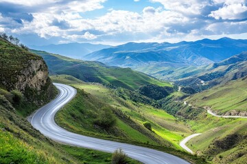 Mountain valley road with clouds