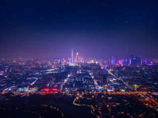 Fototapeta premium Aerial night view of Guangzhou China skyline illuminated with city lights