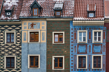 Fototapeta premium Fragment of the facade of historic tenement houses in Poznan Market Square in winter