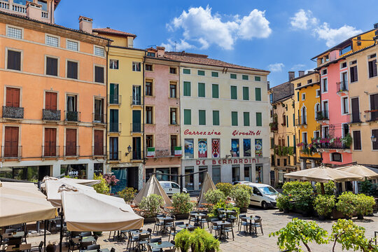 Vicenza, Italy - July 8, 2024: Piazza delle Erbe in the historic center of Vicenza, Italy. This picturesque square is known for its colorful buildings, outdoor cafes, and historic atmosphere.