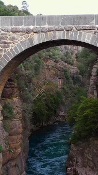 Oluk stone bridge in Koprulu canyon over K&ouml;pr&uuml;&ccedil;ay river, drone video, Manavgat, Antalya, Turkey	