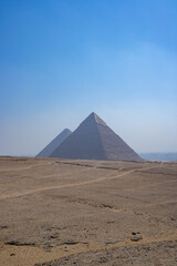 pyramids of giza with blue sky vertical