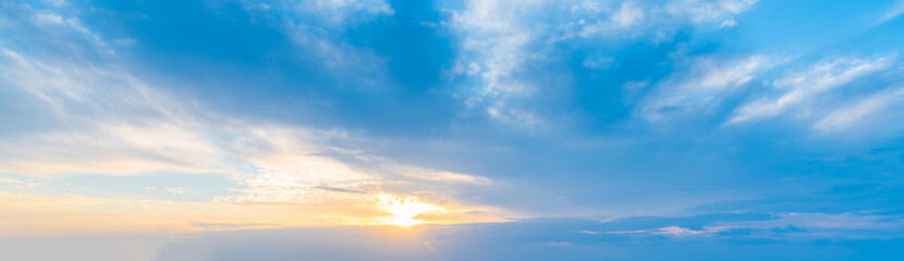 Blue Clouds at Sunset with Yellow and Orange Sunlight