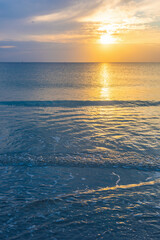 Sunset Over the Sea with Sun and Clouds