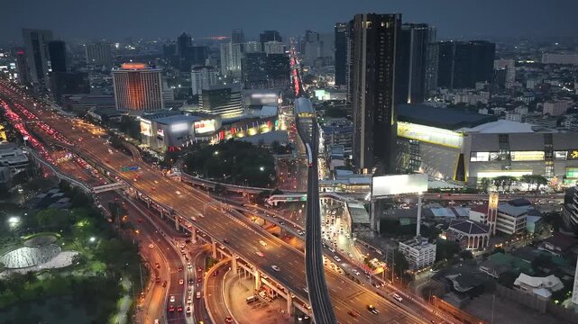 Bangkok City Night Timelapse with Traffic and Skytrain, Urban Business District