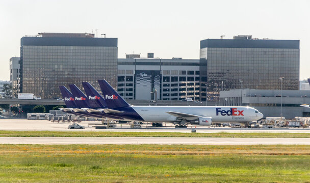 A lineup of FedEx commercial cargo aircraft at Los Angeles International Airport (LAX) - Los Angeles, California, USA