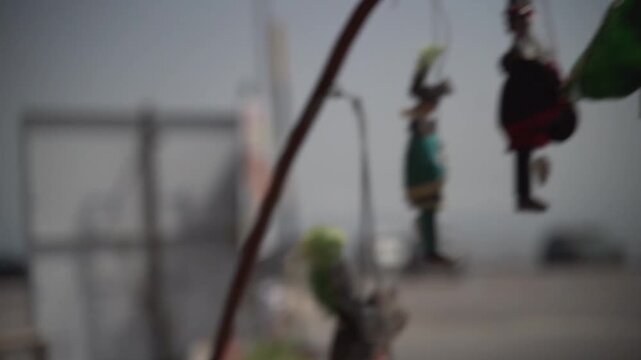 Traditional sicilian pupi marionettes hanging outdoors