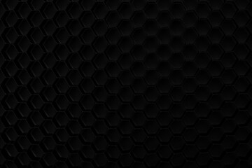 Black hexagonal pattern on a surface with a simple design showing movement and texture in a light setting