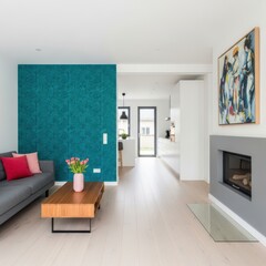 Modern living room with teal accent wall and minimalist decor