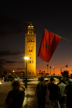 Koutoubia Mosque at Dusk with Moroccan Flag