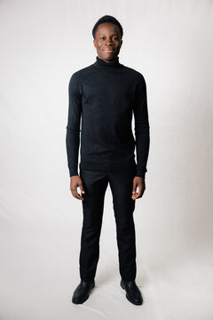 young man standing looking at the camera.