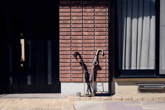 Umbrella Stand by Brick Wall