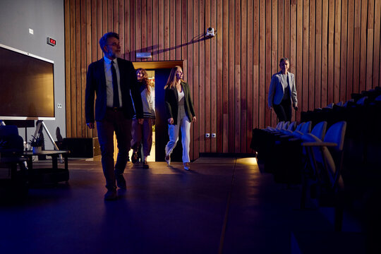 Individuals enter the amphitheater