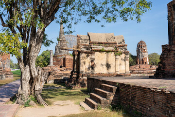 Fototapeta premium Ancient Buddhist Temple Ruins and Buddha Statues in Ayutthaya, Thailand
