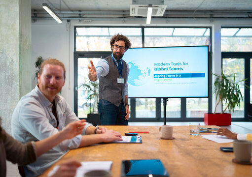 Business team listening to presenter