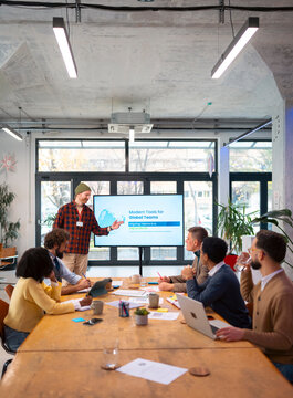 Business presenter explaining digital strategy to a team