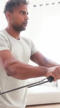 Man Performing Resistance Band Workout at Home in Bright Living Room