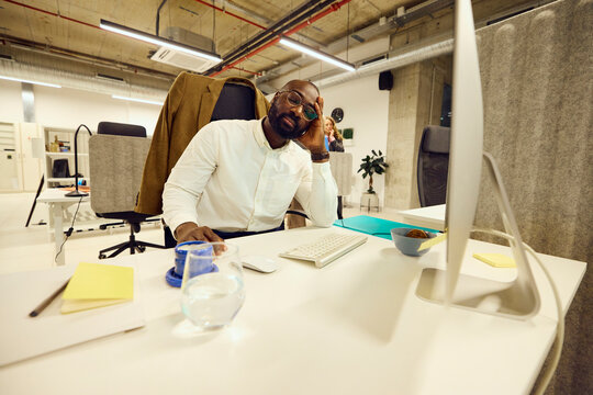Businessman fell asleep at his desk