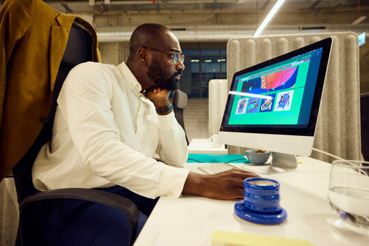 Man engaged in tasks at his computer