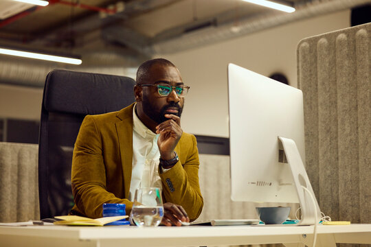 Man focused on work at his computer
