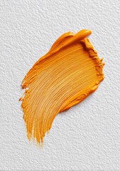 Vibrant orange paint stroke on textured white paper, showing detailed brush marks