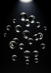soap bubbles isolated on a solid black background. 