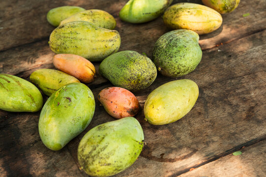 Mangoes on a Wooden Surface