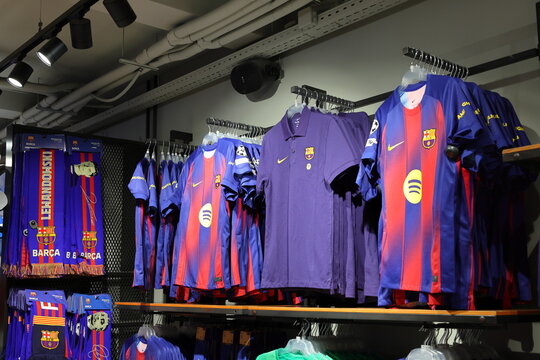 Barcelona football club merchandise on display in store. FCBotiga official store, Barcelona, Spain 11 july 2025.