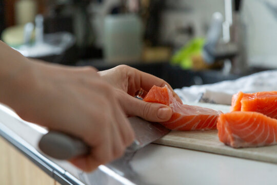 Preparing fresh salmon portions for healthy cooking