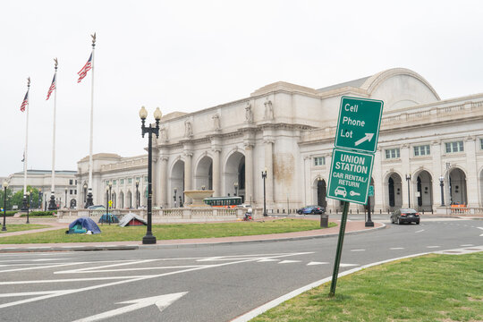 Washington, DC, US - May 12, 2022: Exterior of Union Station and Columbus Circle with a small encampment of homeless citizens living in tents